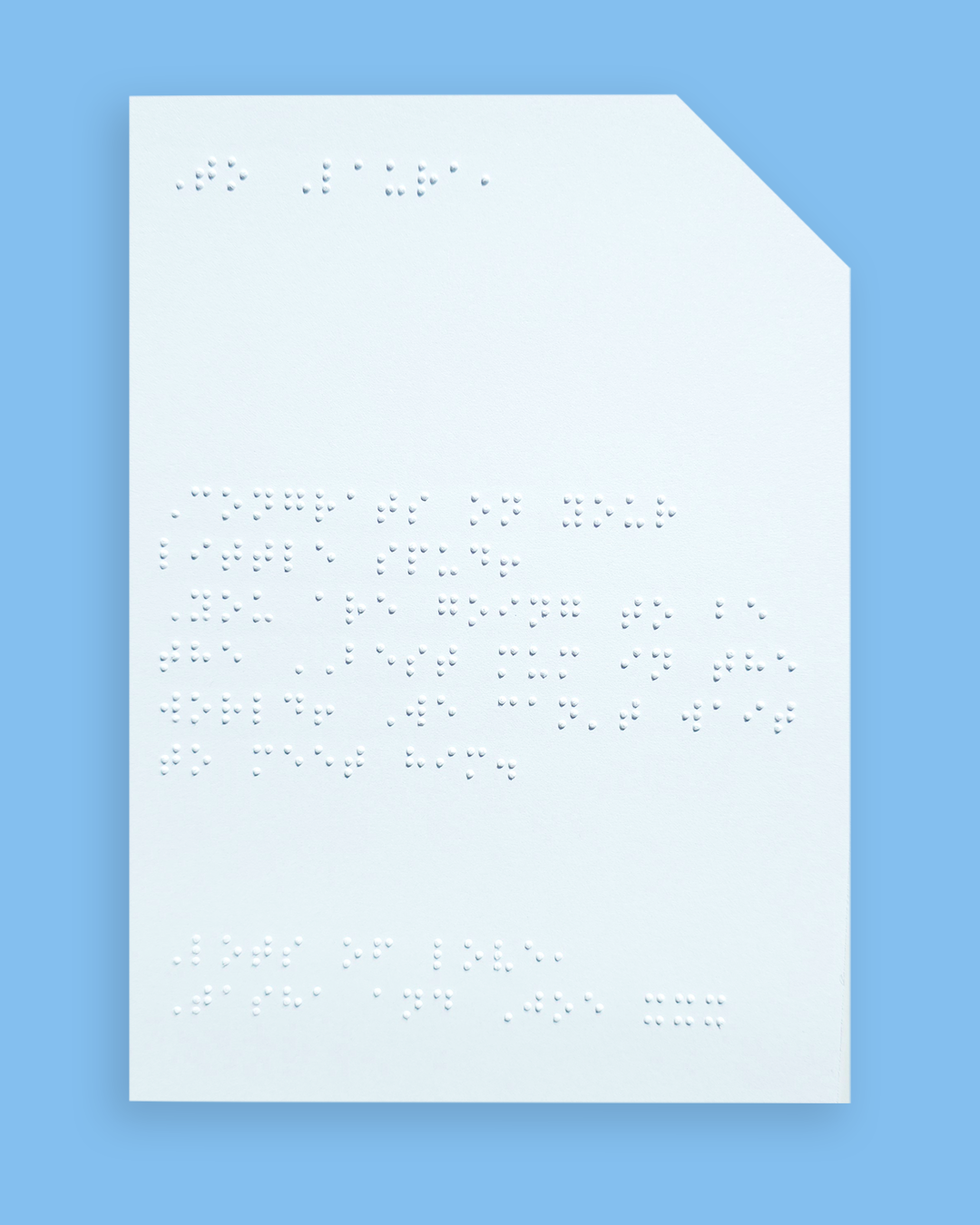 Pale blue background with an example of a braille message inside the card.