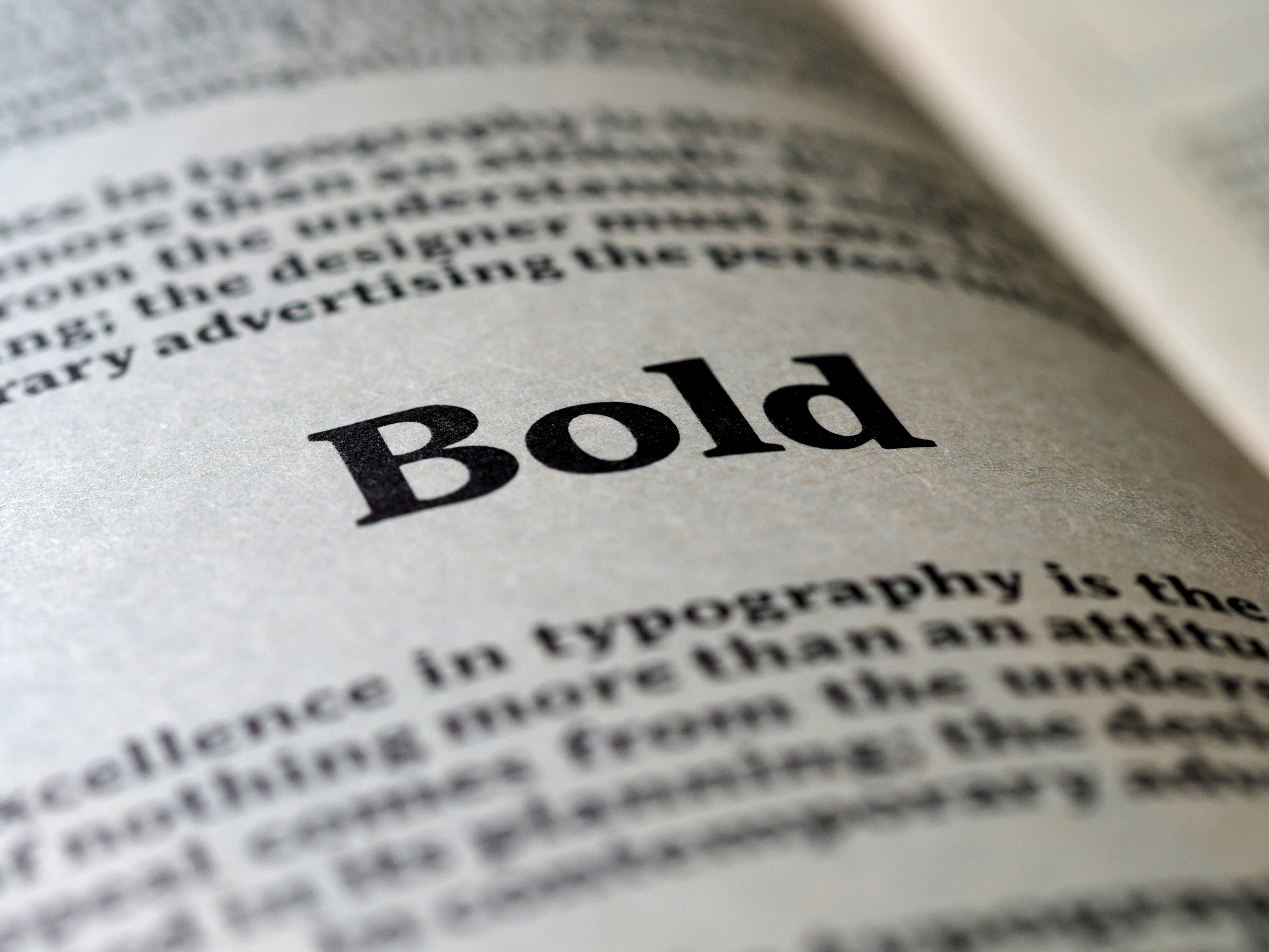 Book page with the word 'Bold' printed on it