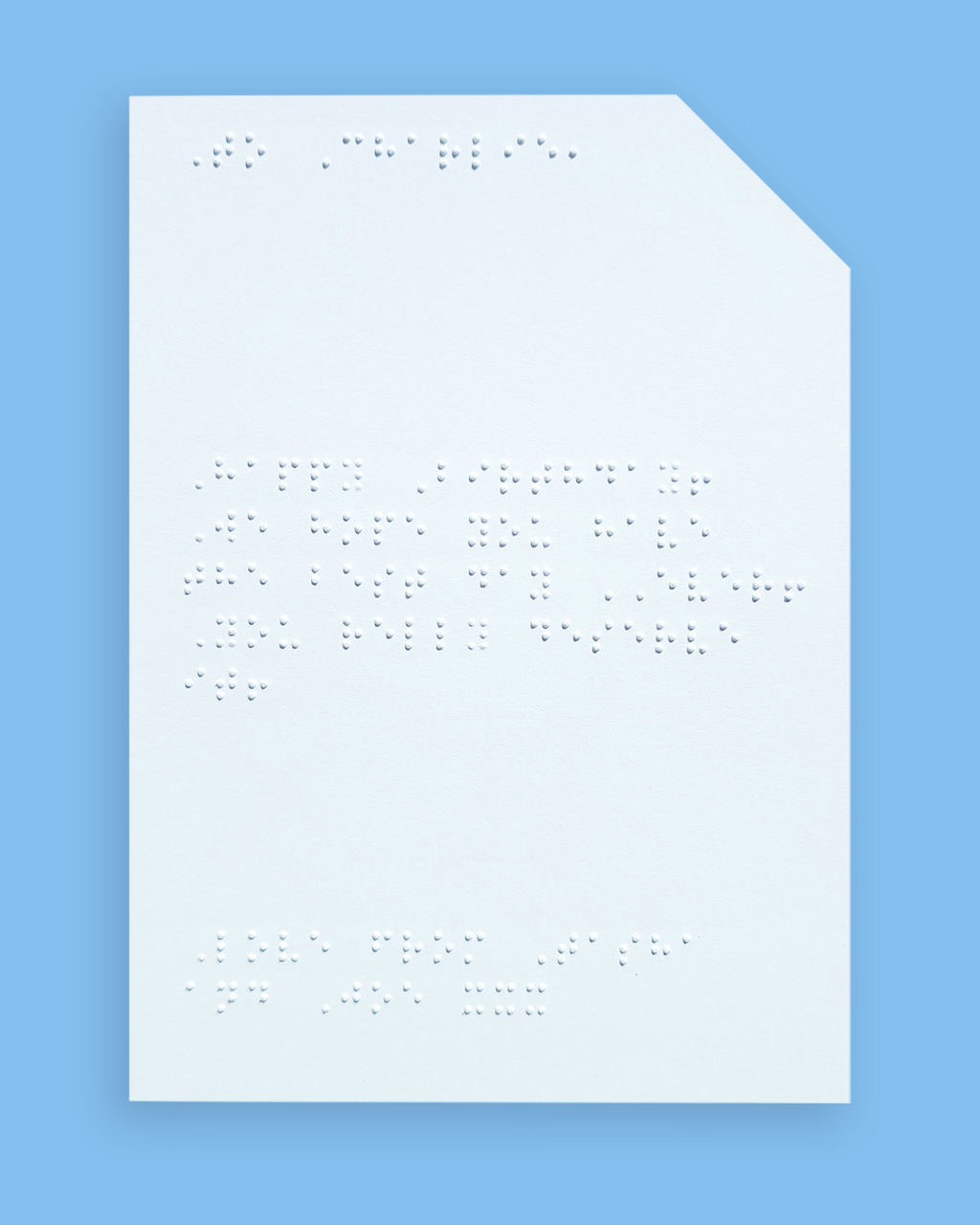 Pale blue background with an example of a braille message inside the card.