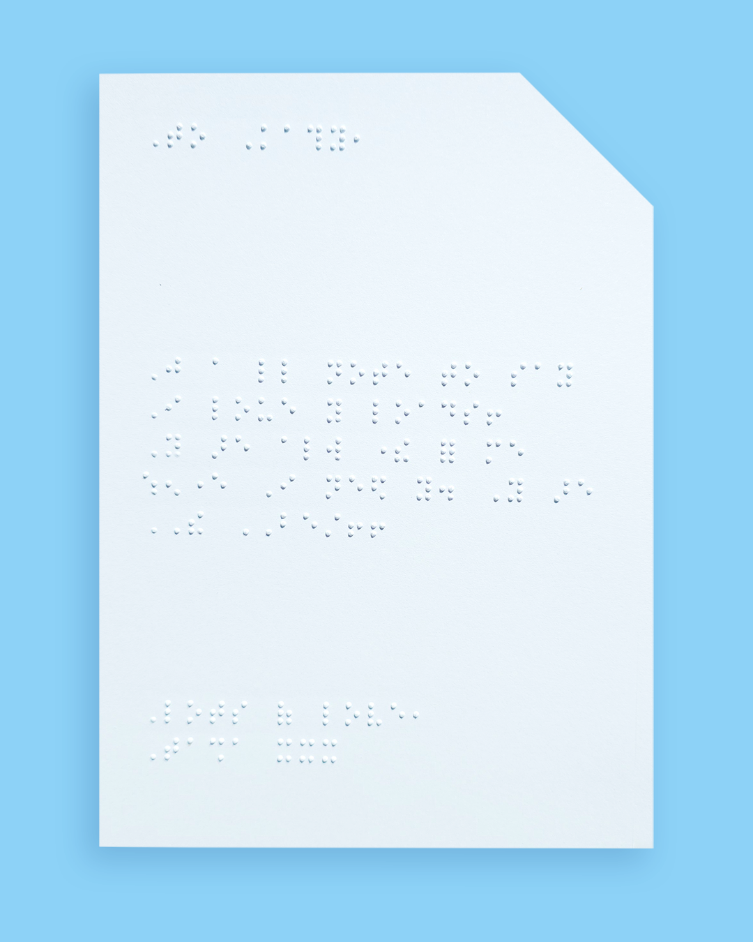 Pale blue background with an example of a braille message inside the card.
