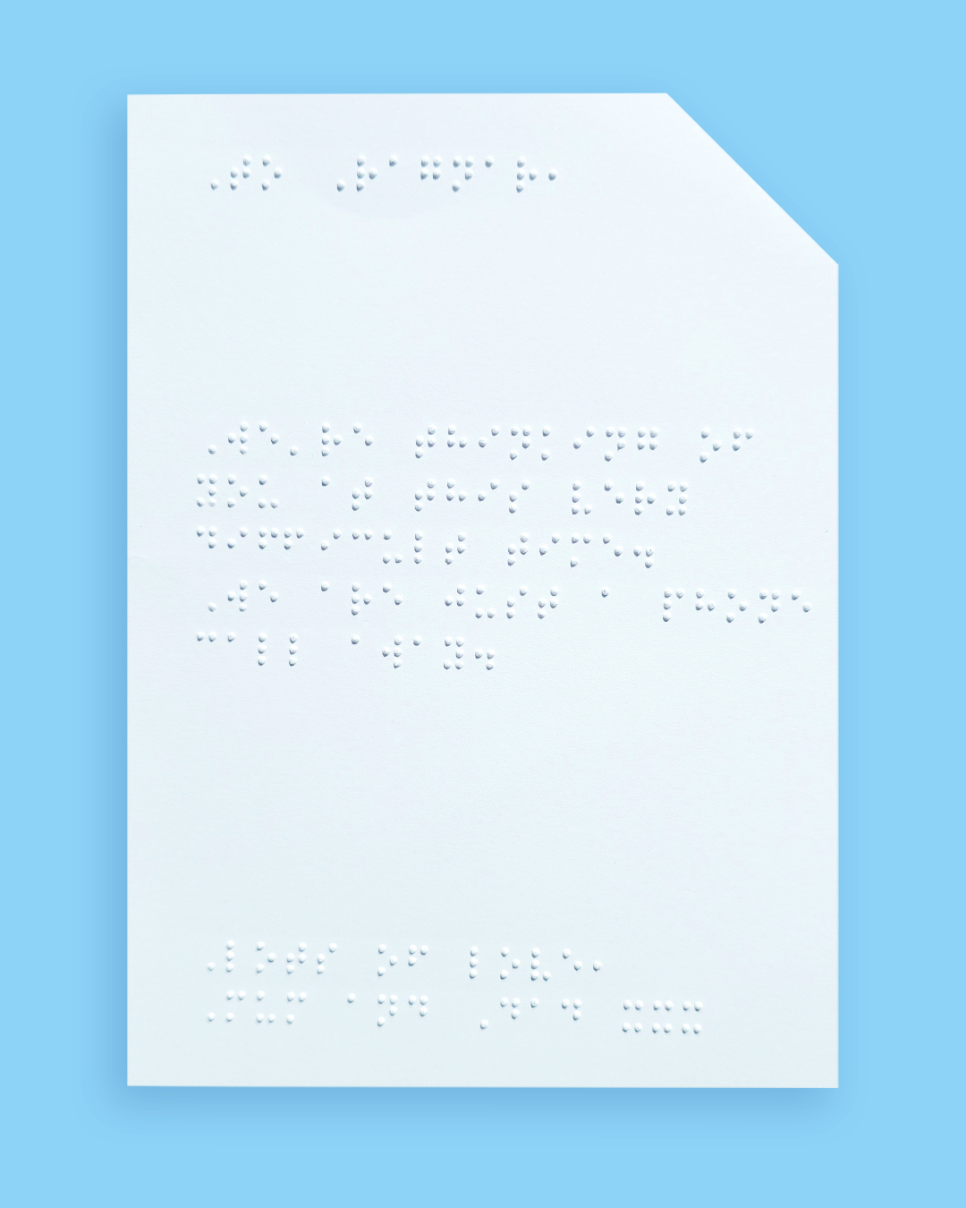 Pale blue background with an example of a braille message inside the card.